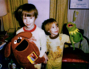 A young Vogel (left) and his brother with Rowlf and Kermit toy puppets.