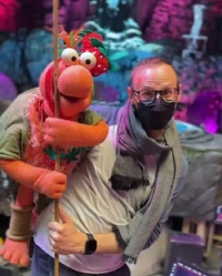 Andrew G. Cooper with a background Fraggle