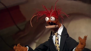 Striped dress shirt, black suit and gold tie.