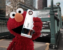 November 25, 2014 "Elmo shows off his boarding pass for Orion's test flight"