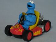 Cookie Monster in a cookie car