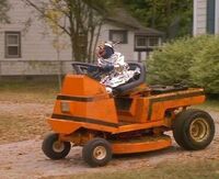 Gonzo driving a lawnmower in Muppets from Space.