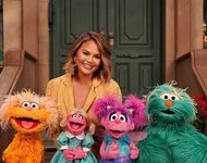 Chrissy Teigen with Zoe, Prairie Dawn, Abby Cadabby, and Rosita