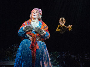 Alice with Pa (as a puppet) in the 2021 production.