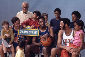 Frazier (right) with Mike Riordan and Dick Barnett