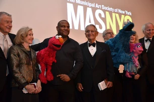 Joan Ganz Cooney and Pete Peterson with the Muppets and crew, including Kevin Clash, David Rudman and Leslie Carrara-Rudolph. Joel Schumacher is at far left, Michael Hoffman, far right.