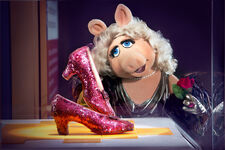 Miss Piggy at the Smithsonian with Dorothy's ruby slippers