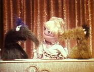 Ruth, Goldie and Johnny turned into Muppets, singing "Mahna Mahna"