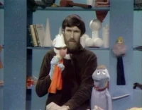 The king with a cup for a crown and fabric for a robe.