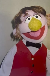 A waiter in the Muppet Workshop being prepared for taping in scenes at the Furry Arms.