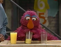 Telly Monster drinks orange juice in Sesame Street Episode 2427