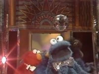 Proto-Elmo Me Lost Me Cookie at the Disco.jpg (191 KB) "Me Lost Me Cookie at the Disco" (First: Episode 1500) Kathryn Mullen