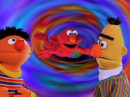 Elmo in Grouchland: Bert and Ernie watch as Elmo falls to Grouchland.