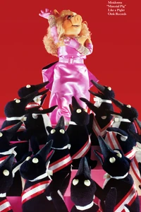 The "Moidonna" poster is a direct spoof of "Material Girl," itself an homage to Monroe's number from Gentlemen Prefer Blondes.