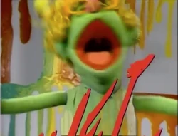 How Now Brown wearing a chroma-keyed vest at the end of "Wet Paint."