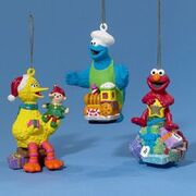 Big Bird with toy, Cookie Monster with train, Elmo on a tree blow mold ornaments SE1801