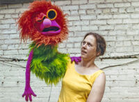 Puppet builder Caroly Wilcox with the oversized version of Mahna Mahna made for the stage show.
