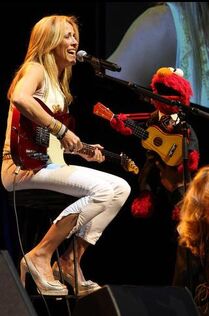 Sheryl Crow performing with Elmo