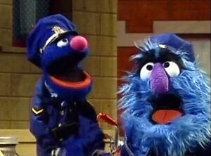 Officer Grover and Herry dispatch a tune.