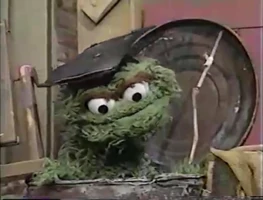 Oscar the Grouch (mortarboard only) in Sesame Street Episode 3494