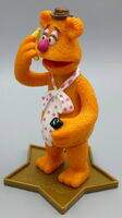 Fozzie holding a cellphone and a banana