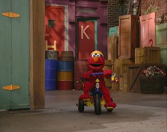 Elmo riding a tricycle Clearance