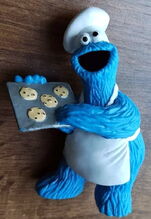 Cookie Monster with a tray of cookies