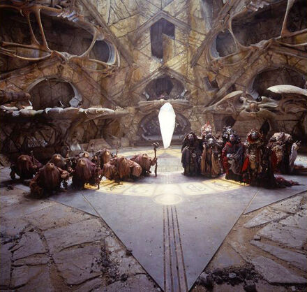 Production photo of Mystics and Skeksis in front of the Pure Crystal