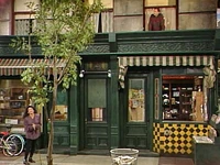 wide shot of building with Fix-It Shop, Hooper's Store, and Bob's apartment from Episode 2722.