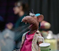 Rizzo spits out his drink in The Muppets "Too Hot to Handler"