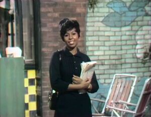 Susan in her nurse's uniform ().