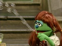 Elizabeth blows some bubbles in Sesame Street Episode 3877