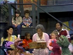 Everyone listens to David's grandma  read a story.