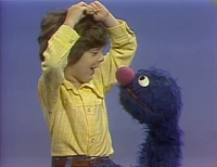 Xmasanother97.jpg (159 KB) Meanwhile, Grover and Kermit ask some kids, including Christopher Wein.