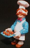 The Swedish Chef as a restaurant owner, with swedish meatballs on a swedish flag tray