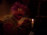 Gobo Fraggle blows out a candle in "Wembley and the Gorgs"