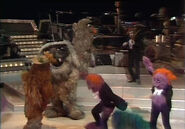 Sweetums drags Dave out of the orchestra