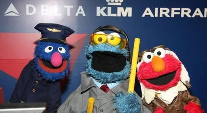 Elmo, Cookie Monster, and Grover at LaGuardia Airport on May 3, 2011.