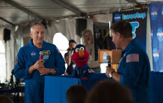 Elmo, Mike Massimino and Douglas H. Wheelock