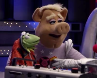 Captain Link impersonates Kermit with a puppet in "The Gravity of the Situation."