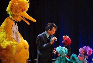 Mitchell performing with the Sesame Street cast.