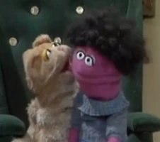 An Anything Muppet girl & a cat"Daddy Helps with the Dishes"