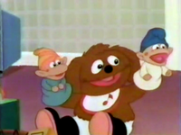 Baby Rowlf plays with Closet Troll puppets on the Muppet Babies episode "Junkyard Muppets."