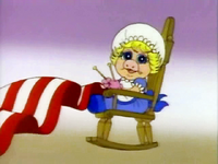 Baby Piggy plays Betsy Ross in the Muppet Babies episode "Out-of-This-World History," during the American history song