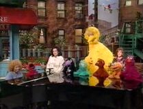 Everyone sings a medley of Sesame songs.