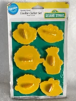 Set of faces, including Elmo, Zoe, Cookie Monster, Big Bird, Bert, and Ernie