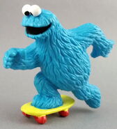 Cookie Monster on a skateboard