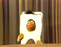 Bert as a tooth in a Sesame Street pageant