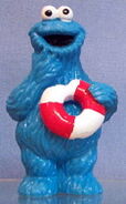 Cookie Monster eating an inner tube