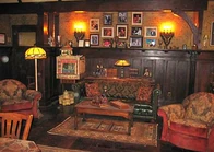 Photographs of Kermit with Celebrities adorn the walls.